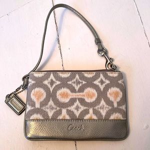 Coach wristlet in grey and peach with pewter leather bottom